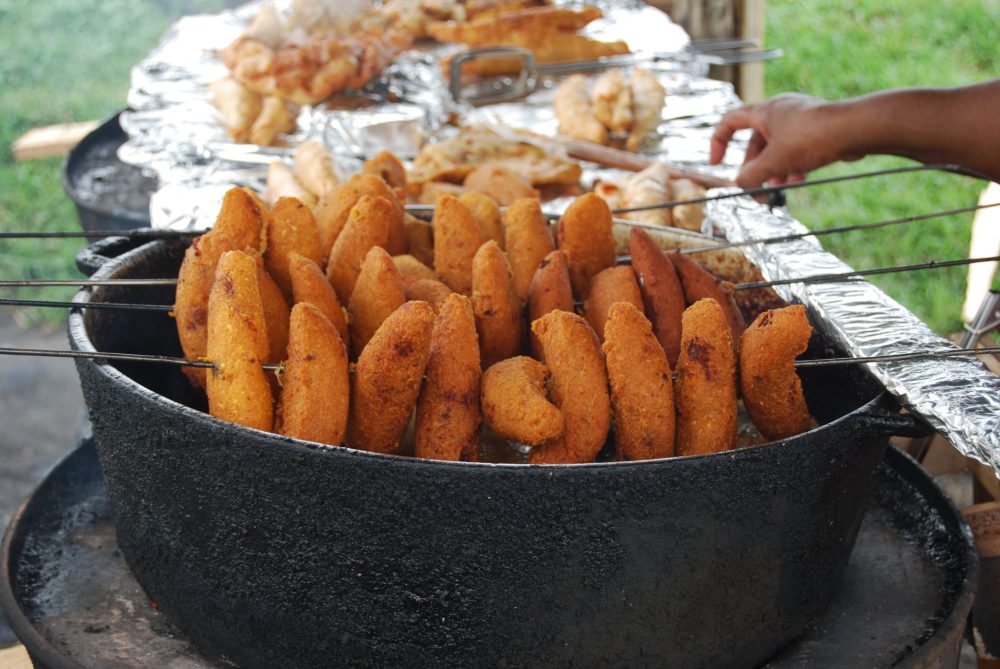 a bowl of fruit on a grill