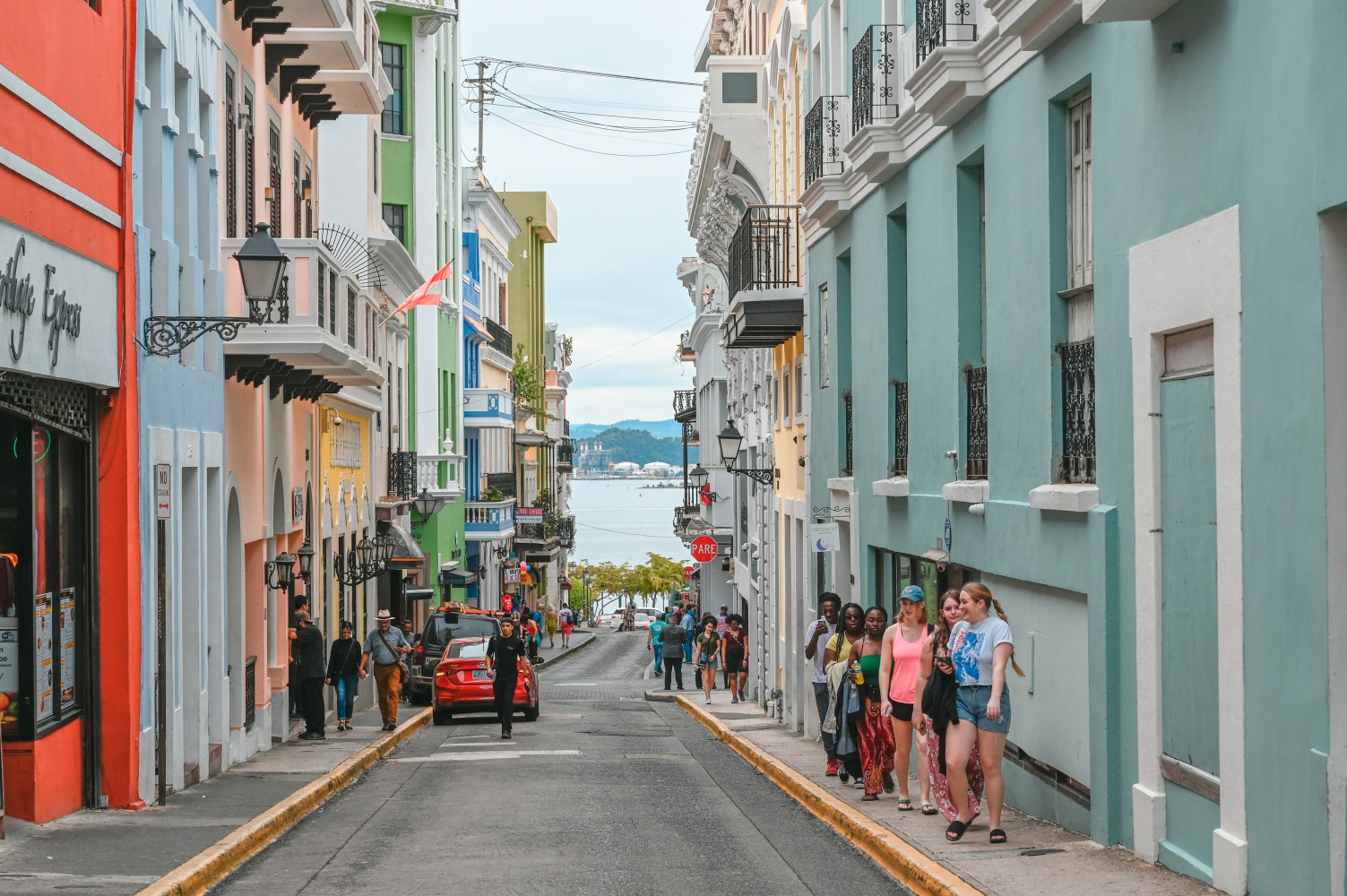 Colorful street with people walking in San Juan, Puerto Rico.